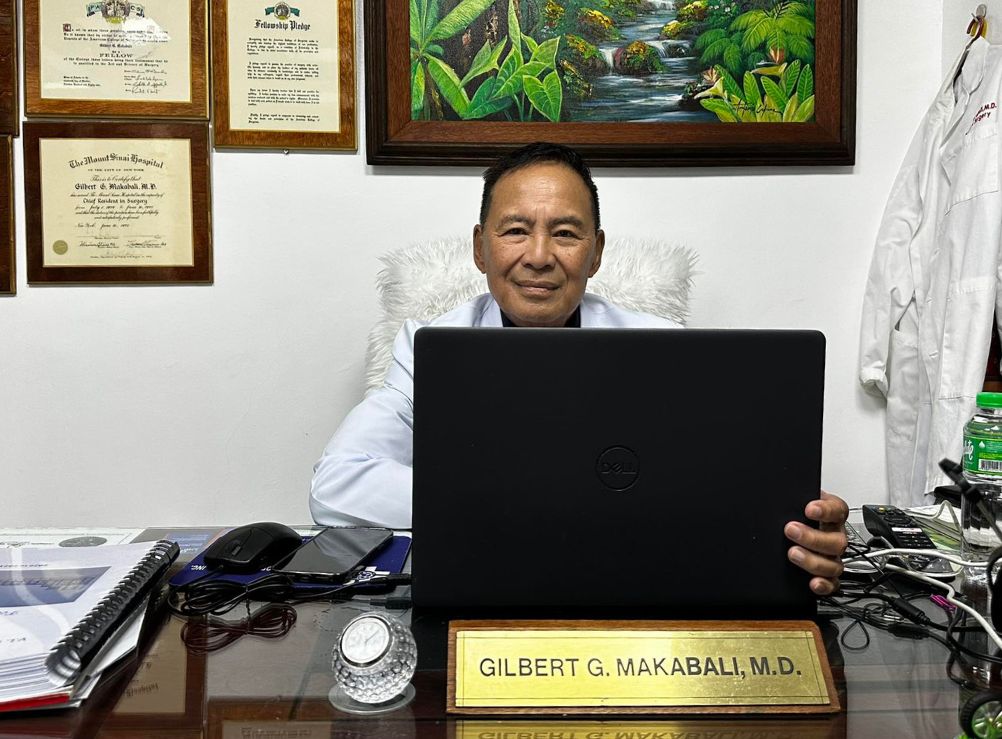 Dr. Gilbert G. Makabali, MD, FACS on his workdesk at VLMMHI